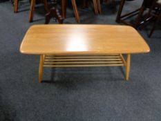 An Ercol ash coffee table with under stretcher CONDITION REPORT: 104cm long by 46cm