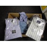 A box of new clothing including shirts,