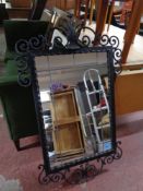 An ornate metal framed mirror