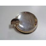 A small silver ashtray