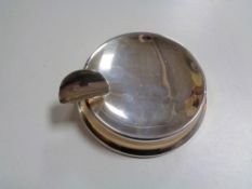 A small silver ashtray