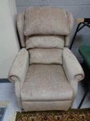 An electric reclining armchair