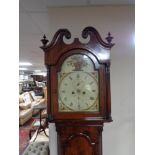 A nineteenth century mahogany longcased clock with painted dial, pendulum and weights.