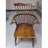 A nineteenth century elm stick backed armchair
