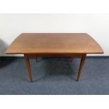 A mid century teak pull out dining table CONDITION REPORT: Unextended this is 138cm