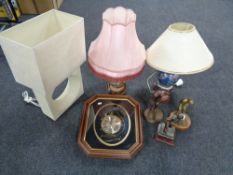 Three golfing trophies together with three table lamps with shades and a clock