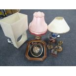 Three golfing trophies together with three table lamps with shades and a clock