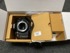 A Nikon D5100 digital camera, body only, no lens cap, with strap, with two cables only, boxed.