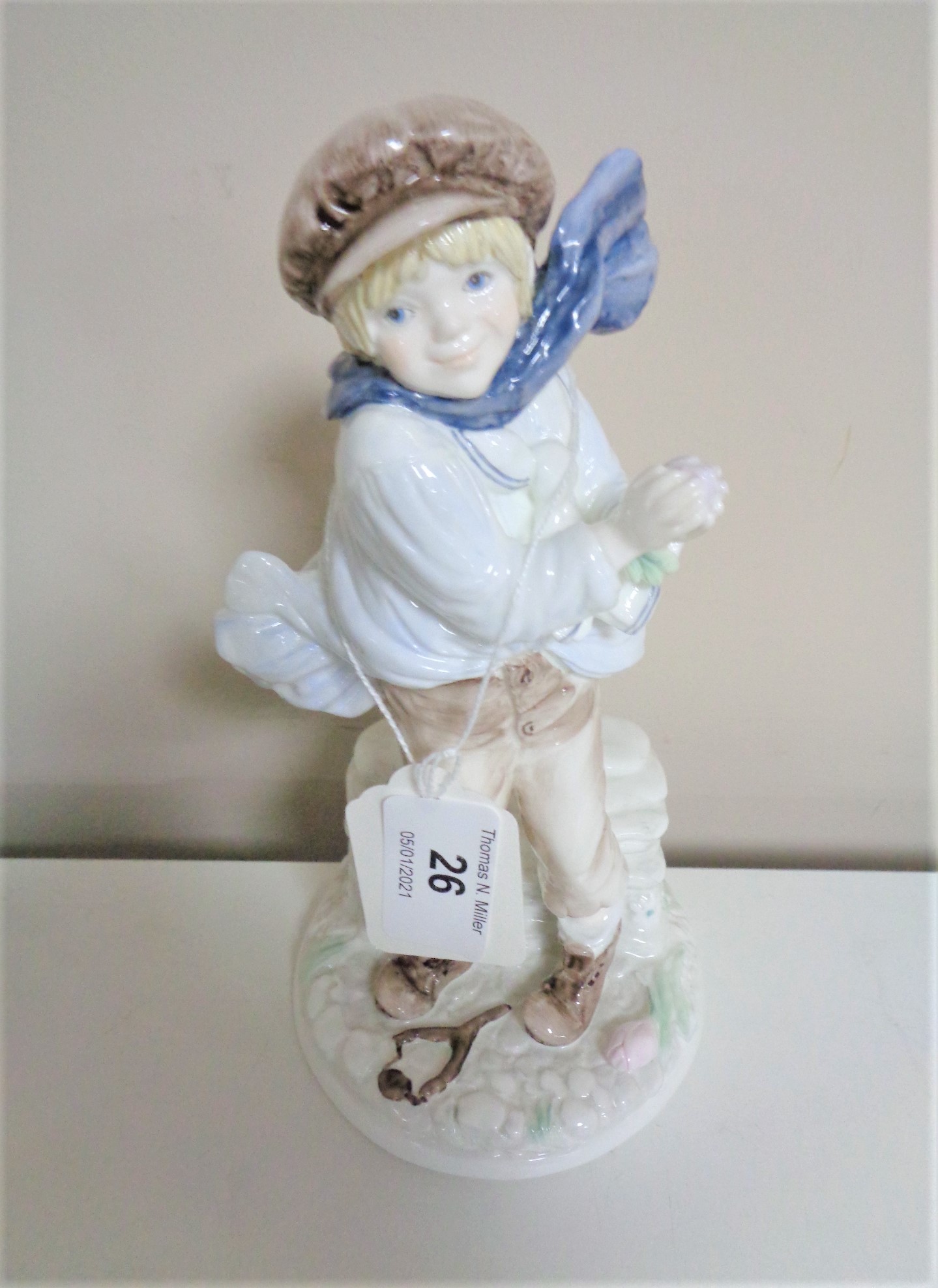 A Coalport figure, The Boy, limited edition number 887 of 9500.