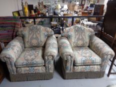 A four piece lounge suite comprising of three seater and three armchairs