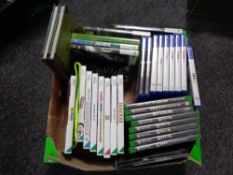 A box of Play Station 4 games, Xbox 360 games,