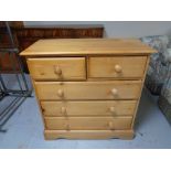 A pine five drawer chest