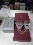 Four boxed crystal glasses and goblets,