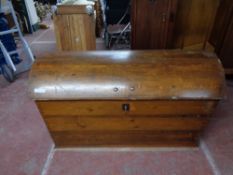 A nineteenth century pine dome topped trunk with key