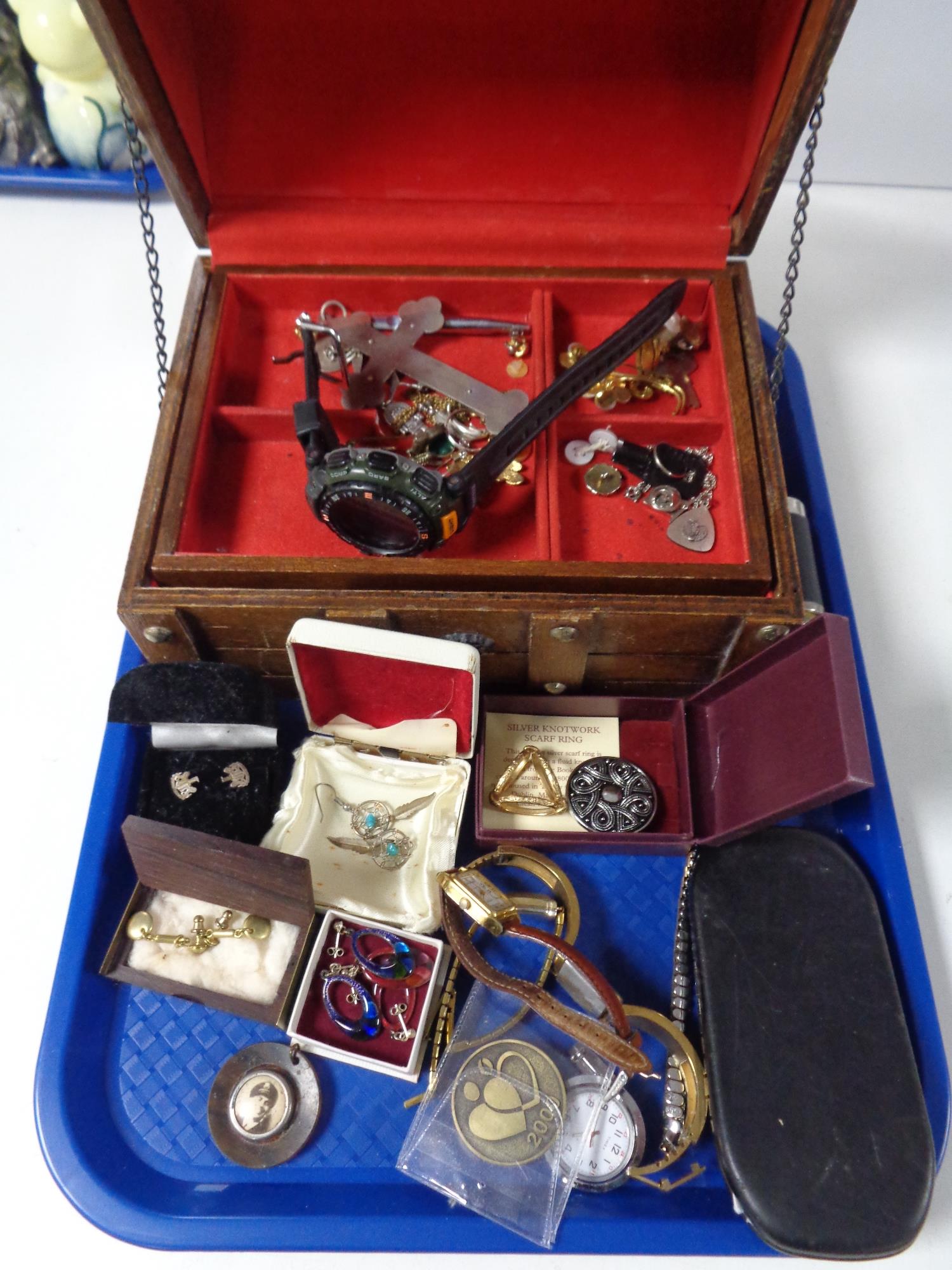 A casket of costume jewellery, wrist watches,