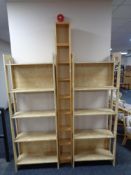A set of pine Ikea CD shelves together with a pair of bookshelves