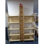 A set of pine Ikea CD shelves together with a pair of bookshelves