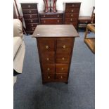 A contemporary eight drawer chest with brass handles