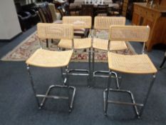 A set of four contemporary bergere seated breakfast bar stools