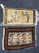 A small Sino-Tibetan silk rug depicting a bird,