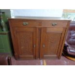 An early twentieth century oak sideboard