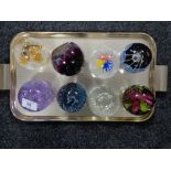 A collection of eight Caithness paperweights.