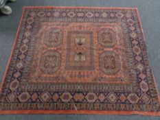 An Afghan rug of geometric design, 146 cm x 168 cm.