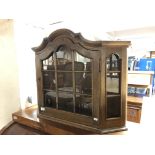 An oak curio wall cabinet