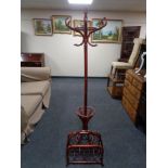 A Bentwood hat and coat stand together with a bamboo and wicker magazine rack