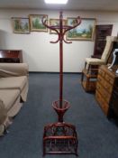 A Bentwood hat and coat stand together with a bamboo and wicker magazine rack