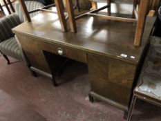 An early twentieth century oak pedestal desk CONDITION REPORT: 131cm wide by 67cm
