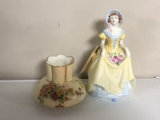 A Coalport figure depicting a lady wearing a flowing dress together with a Royal Worcester blush