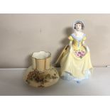 A Coalport figure depicting a lady wearing a flowing dress together with a Royal Worcester blush