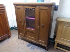 An early twentieth century oak side cabinet