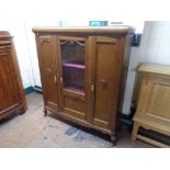 An early twentieth century oak side cabinet