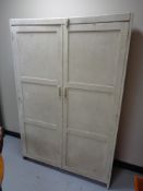 An antique pine double door cabinet CONDITION REPORT: Generally in distressed