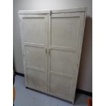 An antique pine double door cabinet CONDITION REPORT: Generally in distressed