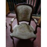 A continental walnut tapestry seated salon chair