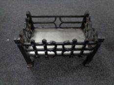 An antique style metal fire grate