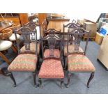 A set of four Edwardian mahogany dining chairs together with a pair of matching nursing chairs