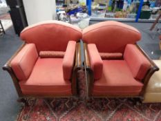 A pair of Edwardian bergere armchairs on paw feet