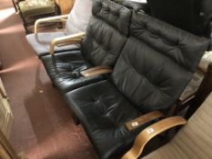 A pair of black leather relaxer chairs CONDITION REPORT: General minor scuffs and