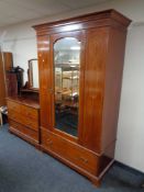 A late Victorian inlaid mahogany mirror door wardrobe together with four drawer dressing chest