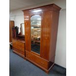 A late Victorian inlaid mahogany mirror door wardrobe together with four drawer dressing chest