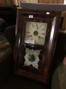 A nineteenth century mahogany wall clock