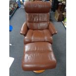 An Ekornes stressless brown leather reclining armchair with footstool