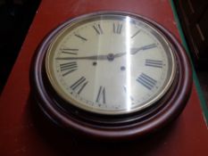 A nineteenth century mahogany circular wall clock CONDITION REPORT: 12" dial.