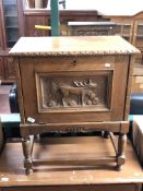 A mid century oak storage cabinet