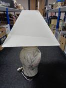A decorative china table lamp with shade.