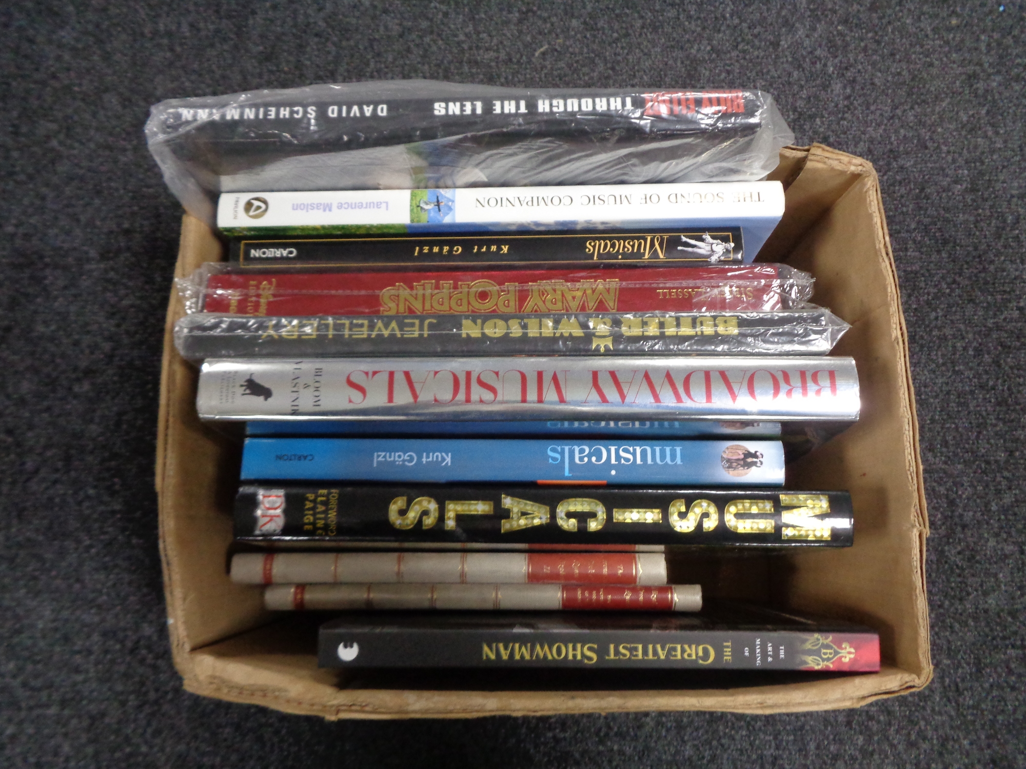 A box of books including musicals,